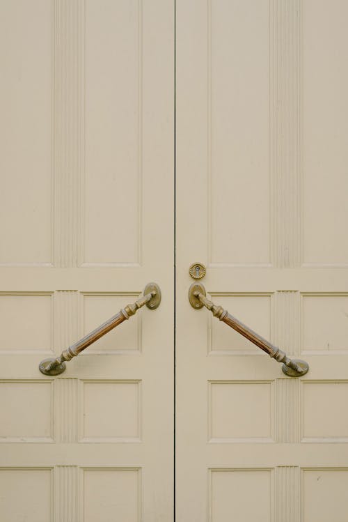 Free White wooden door with metal handles Stock Photo